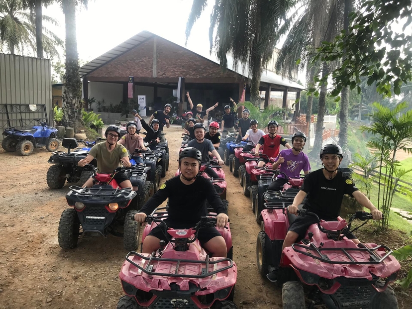 The team on an ATV trail during a company offsite
